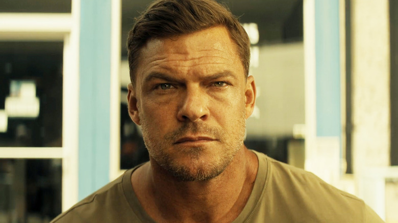 Alan Ritchson's Jack Reacher stares straight ahead in closeup in Reacher