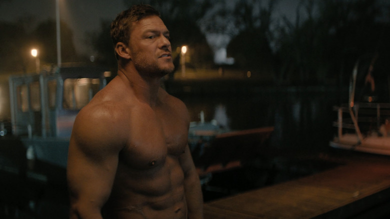Alan Ricchson while Jack Retshire stands naked on the dock in Reacher