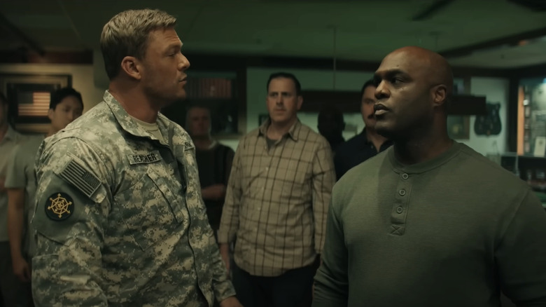 Alan Ritchson's Jack Reacher squares up to an army soldier in Reacher