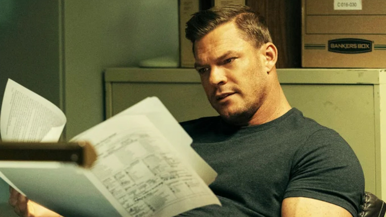 Reacher, Reacher reading some files in his office (flashback scene)