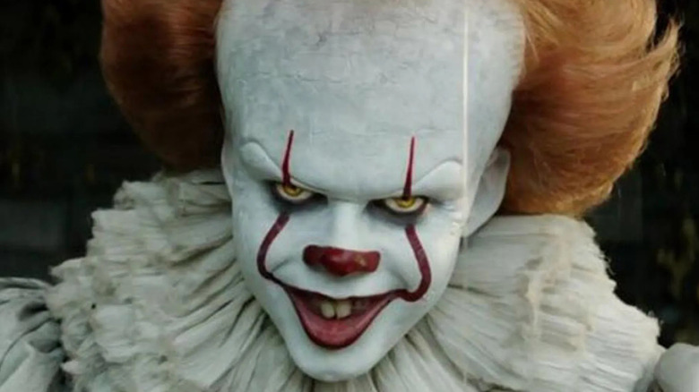 Bill Skarsgård as Pennywise the clown in close-up in It: Chapter One