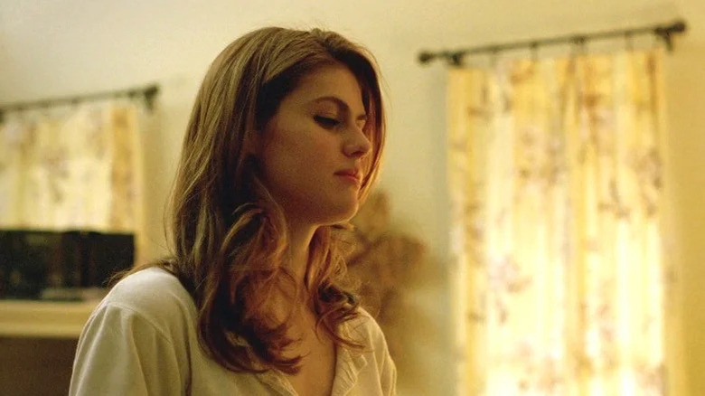 Lisa Tragnetti looking down at someone in her apartment on True Detective