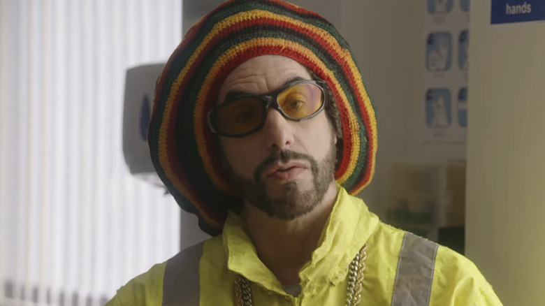 Sacha Baron Cohen's Ali G sits in a doctor's office in Ali G: Who Iz I?