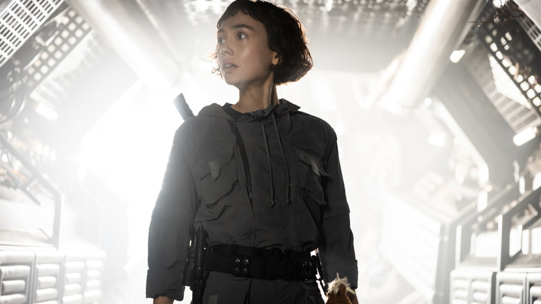 Wendy looking concerned in the middle of a bright hallway in Alien: Earth