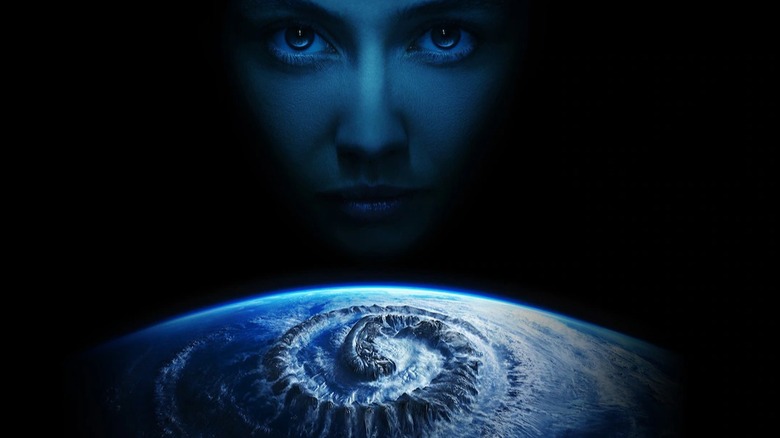 Alien: Earth poster of Wendy looking over Earth with a Xenomorph symbol on it