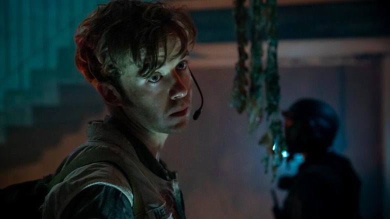 Alex Lawther's Hermit looks unfocused while exploring a spaceship crash in Alien: Earth
