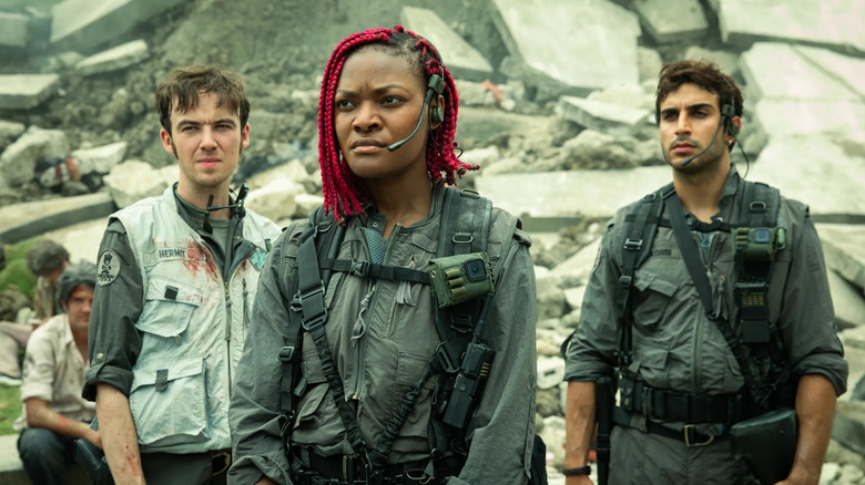 Alex Lawther as Hermit, Diêm Camille as Siberian and Moe Bar-El as Rashidi survey the damage in Alien: Earth
