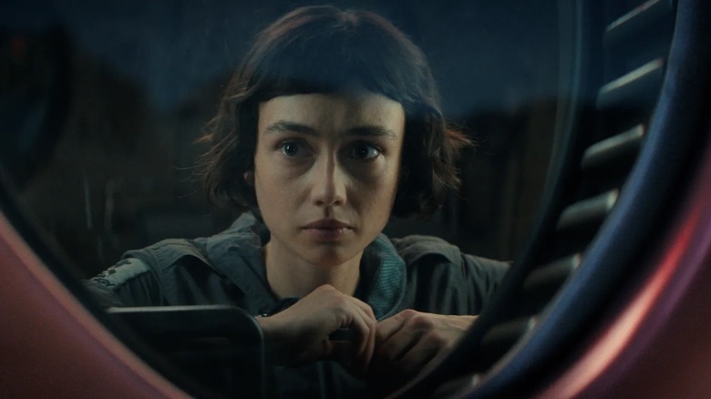 Sydney Chandler peers through a portal as Wendy in Alien: Earth