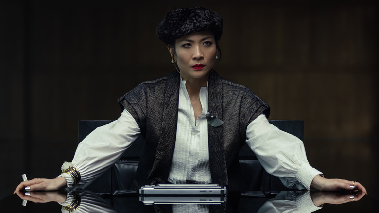 Yutani spreading her arms dramatically on a conference table in Alien: Earth