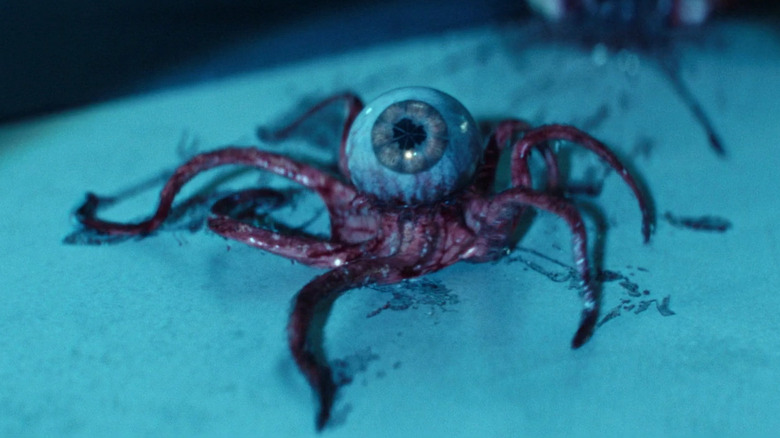 Species 64 looking up with an open eyeball in Alien: Earth