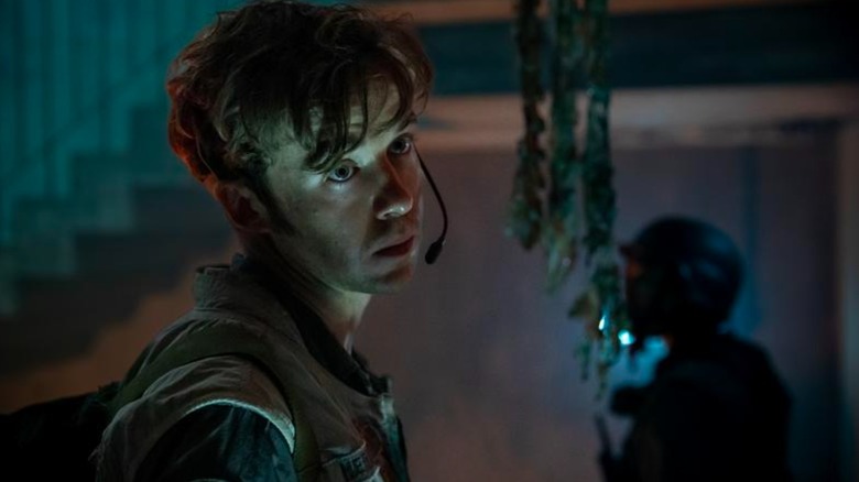 Alex Lawther's Hermit looks unfocused while exploring a spaceship crash in Alien: Earth
