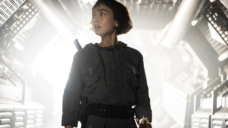 Sydney Chandler as Wendy in front of a blast of white light in Alien: Earth