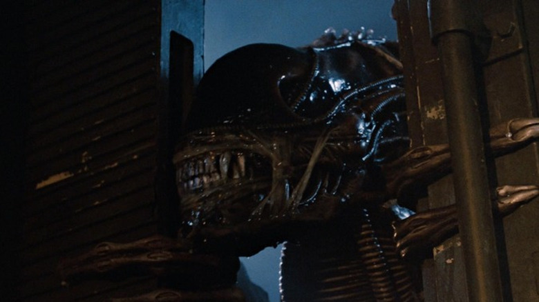 A xenomorph tries to breach an armored vehicle in "Aliens" (1986)