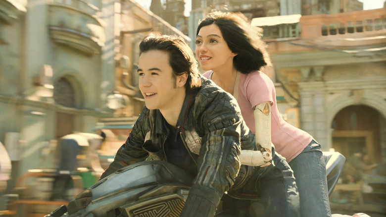 Battle Angel Hugo and Alita riding bike together