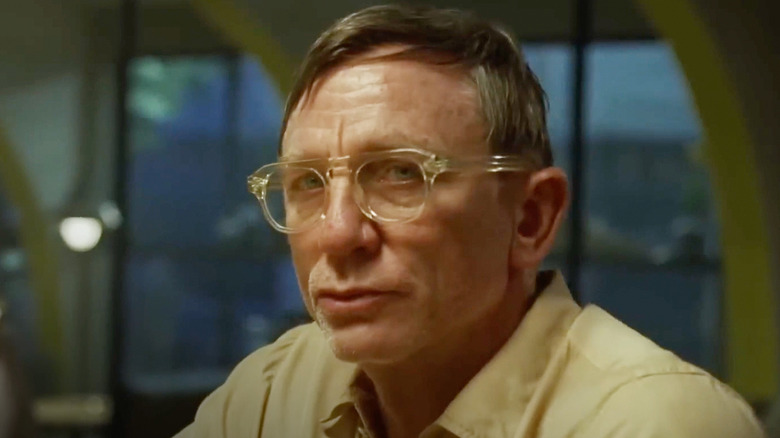 Daniel Craig as William Lee, looking through glasses in Queer