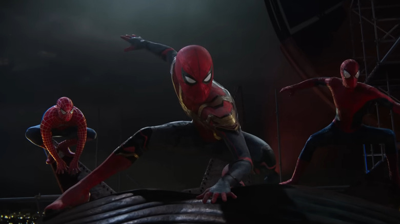 All three versions of Spider-Man, posed together on the statue of liberty in Spider-Man: No Way Home