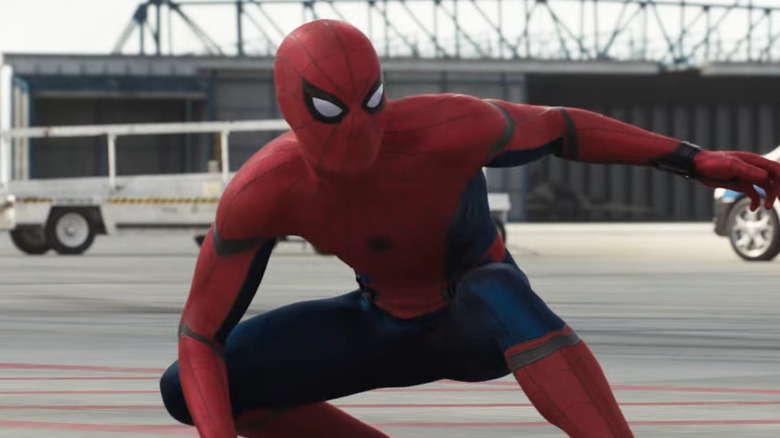 Spider-Man sliding on the ground at the airport in Captain America: Civil War