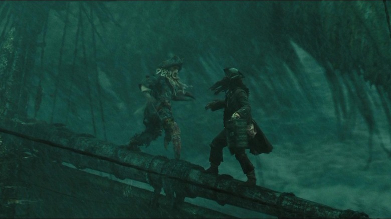 Bill Nighy as Davy Jones and Johnny Depp as Jack Sparrow, fighting on a mast in Pirates of the Caribbean At World's End