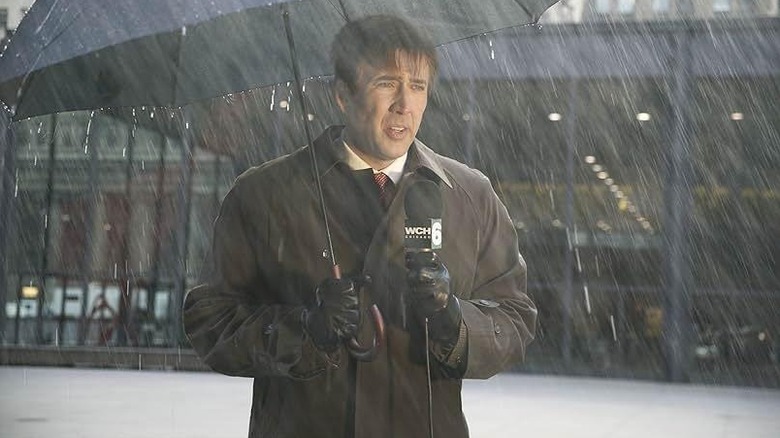 Nicolas Cage as Dave, getting rained on in The Weather Man