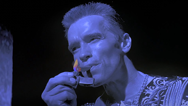 Arnold lighting a cigar
