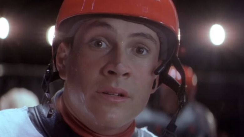 Chris Klein putting on Rollerball helmet