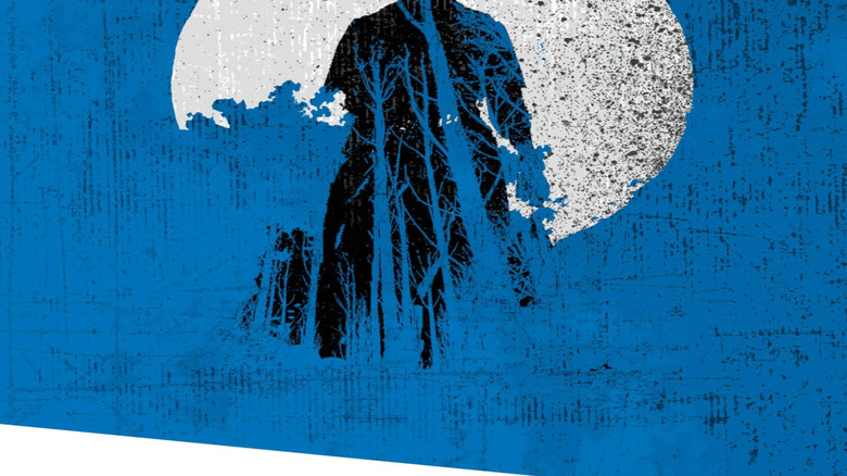 The silhouette of a woman stands framed in a full moon on the cover of Outer Dark