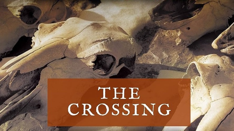The Crossing title over a pile of bleached cattle skulls