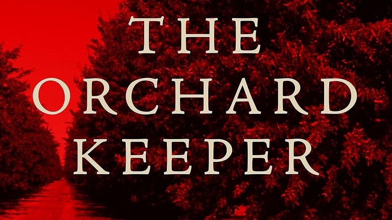 The Orchard Keeper in white text over a red tinted image of an orchard