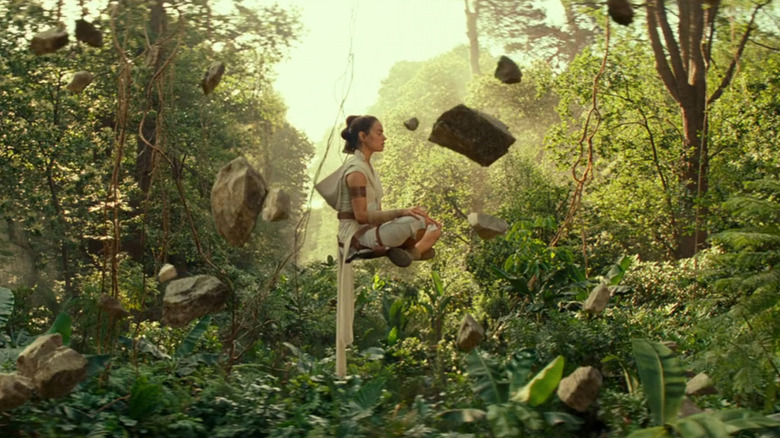 Rey (Daisy Ridley) levitating with rocks in The Rise of Skywalker