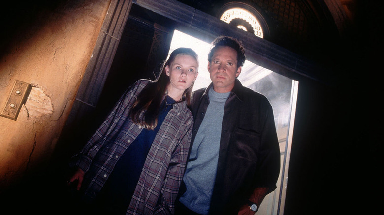 Kristen Dunst and Steve Guttenberg as Anna Petersen and Buzzy Crocker try to survive the Hollywood Tower Hotel in Tower of Terror