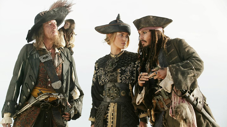Geoffrey Rush, Keira Knightley, and Johnny Depp as legensary pirates Hector Barbossa, Elizabeth Swann, and Jack Sparrow in Pirates of the Caribbean: At World's End