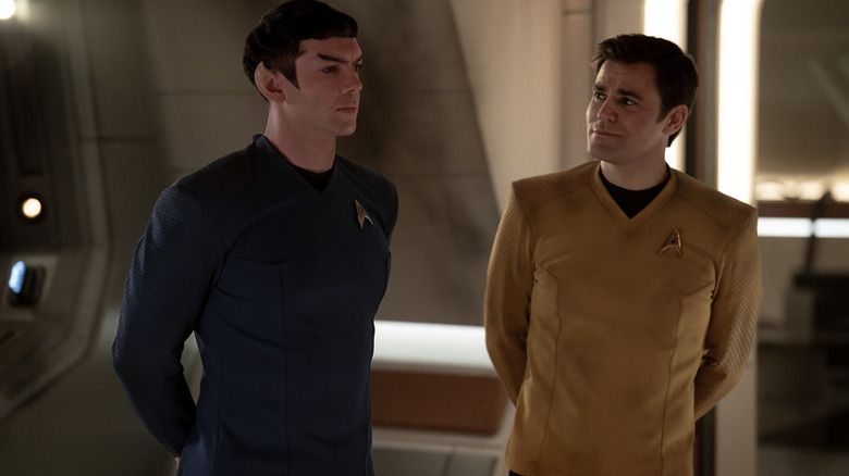 James T. Kirk (Paul Wesley) smiles at Spock (Ethan Peck) in Star Trek: Strange New Worlds