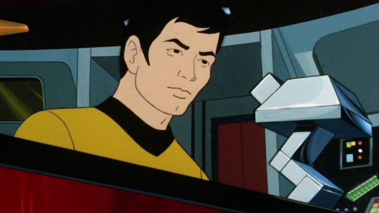 Hikaru Sulu (George Takei) sits behind a console in Star Trek: The Animated Series