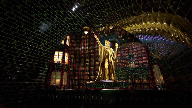 A giant statue looms over the ride queue of Harry Potter and the Battle at the Ministry