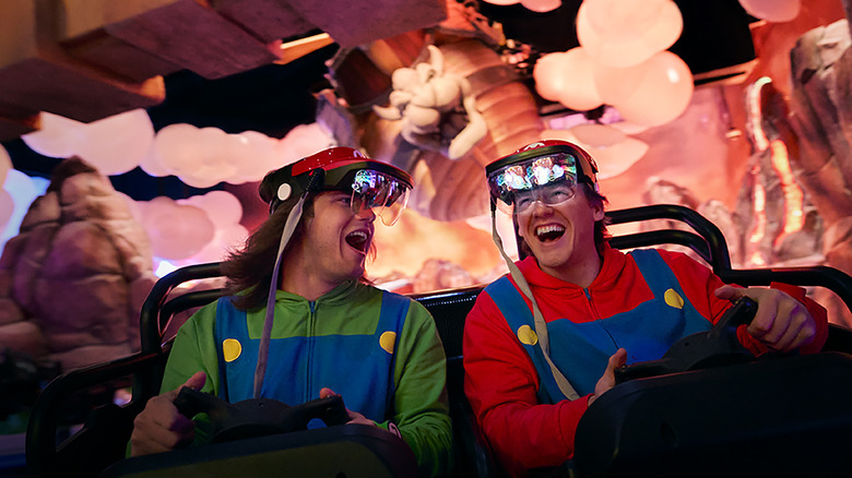 two riders enjoy Mario Kart: Bowser's Challenge at epic universe