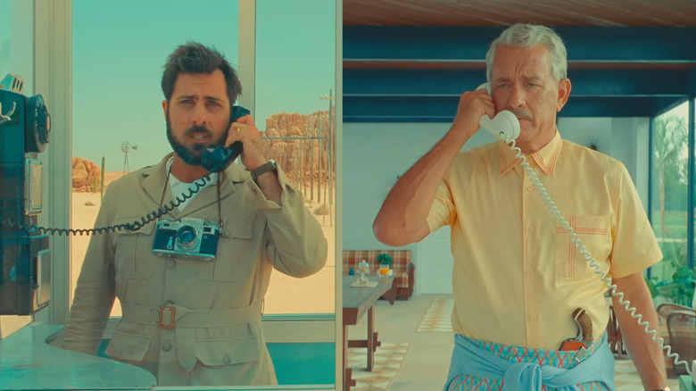 Jason Schwartzman and Tom Hanks as Augie and Stanley, speaking on the phone in a split-screen shot in Asteroid City
