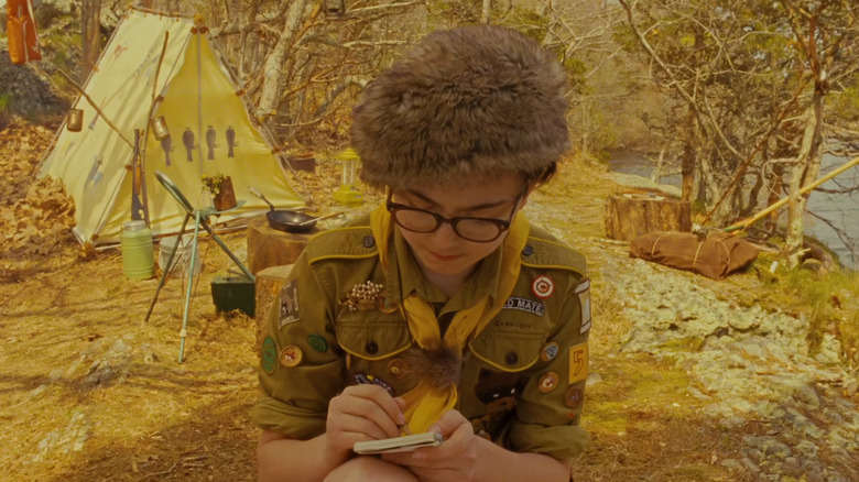 Jared Gilman as Sam Shakusky, taking notes at a campsite in Moonrise Kingdom