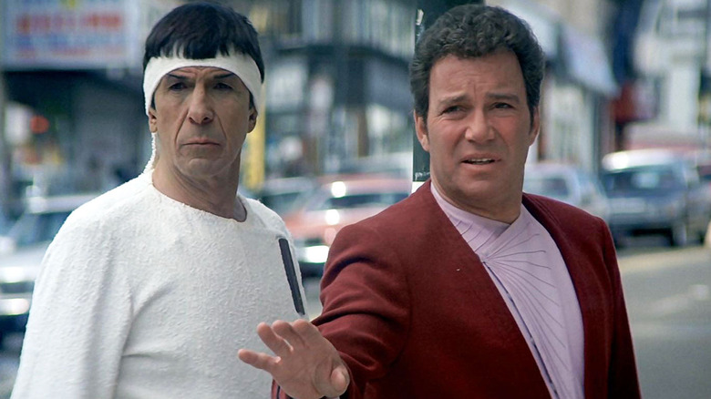 Spock (Leonard Nimoy) and Jim Kirk (William Shatner) stand on a 20th century street corner in Star Trek IV: The Voyage Home