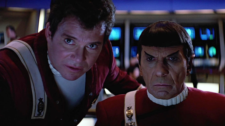 Jim Kirk (William Shatner) and Spock (Leonard Nimoy) stare intently at a monitor in Star Trek V: The Final Frontier