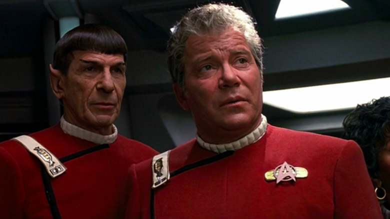 Spock (Leonard Nimoy) and Jim Kirk (William Shatner) stand together pensively in Star Trek VI: The Undiscovered Country