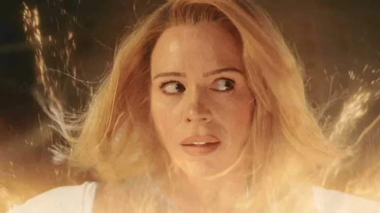 A woman resembling Rose Tyler (Billie Piper) looks confused in regeneration energy in Doctor Who