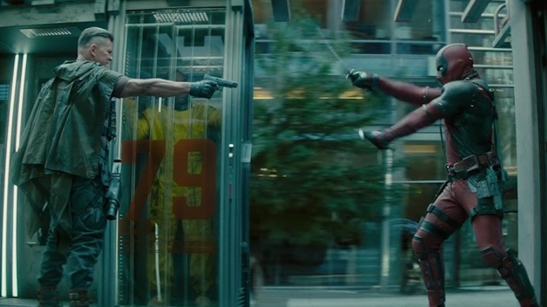 Josh Brolin as Cable and Ryan Reynolds as Deadpool fighting on a prisoner transport vehicle in Deadpool 2