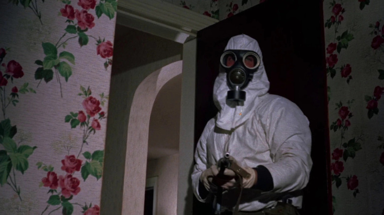 Figure in gasmask