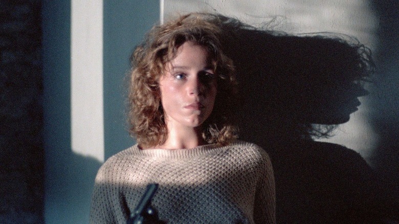 Frances McDormand as Abby, sitting in the dark in Blood Simple