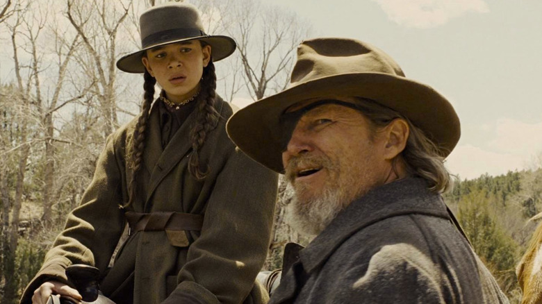 Jeff Bridges as Deputy U.S. Marshal Rooster Cogburn and Hailee Steinfeld as Mattie in True Grit