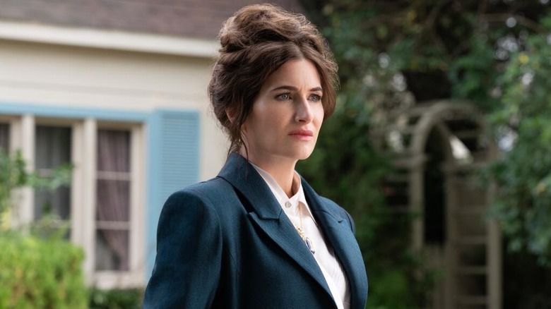 Kathryn Hahn as Agatha Harkness, standing outside of a home on Agatha All Along
