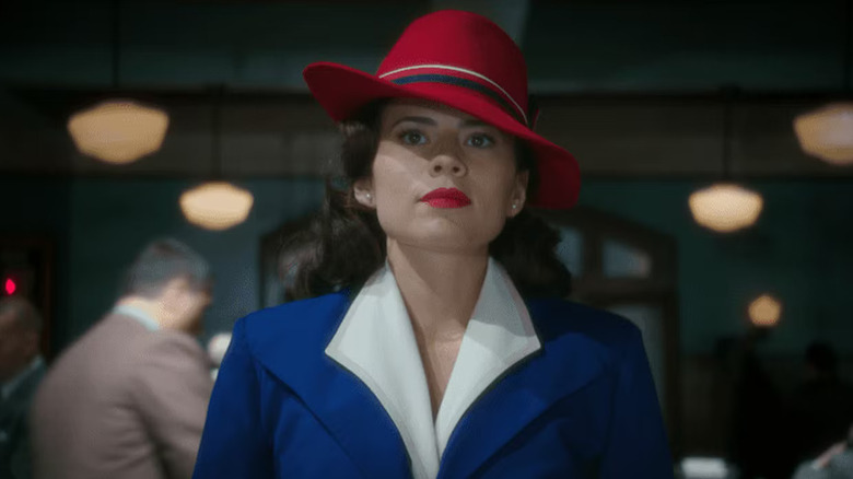 Haley Atwell as Peggy Carter wearing a red hat on Agent Carter
