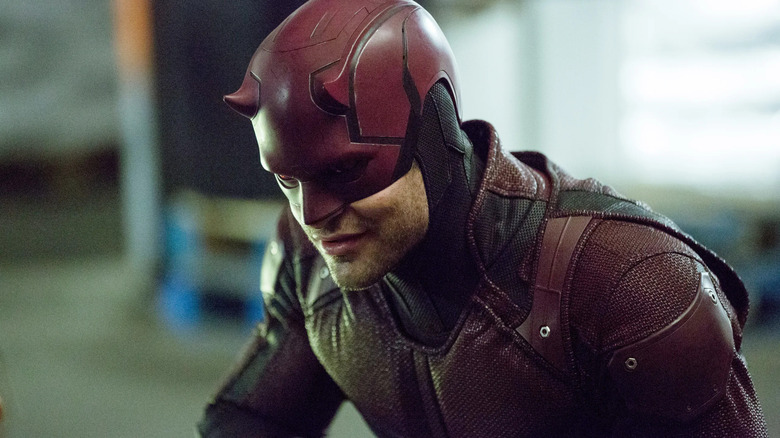 Charlie Cox as Daredevil, kneeling down on Netflix's Daredevil