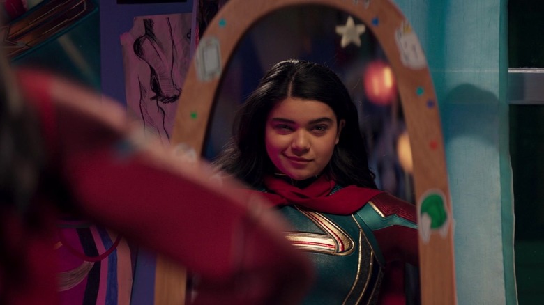 Iman Vellani as Ms. Marvel, looking at herself in the mirror on Ms. Marvel