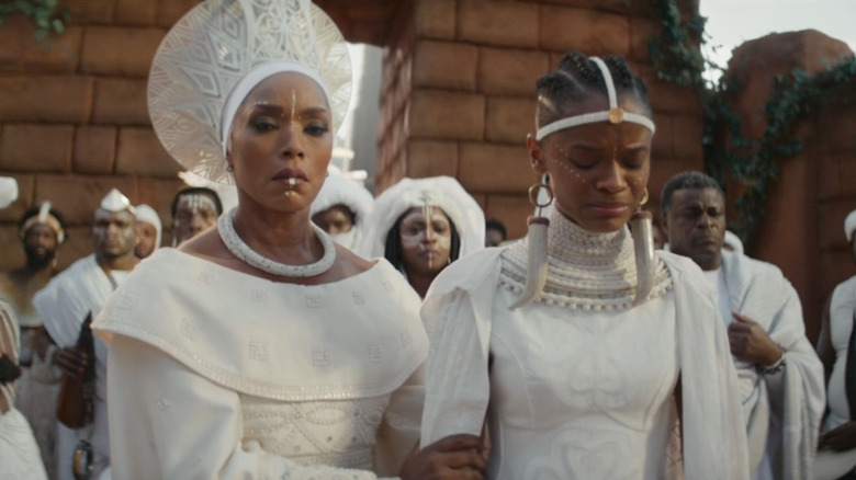 Ramonda (Angela Bassett) and Shuri (Letitia Wright) mourning T'Challa in Black Panther: Wakanda Forever